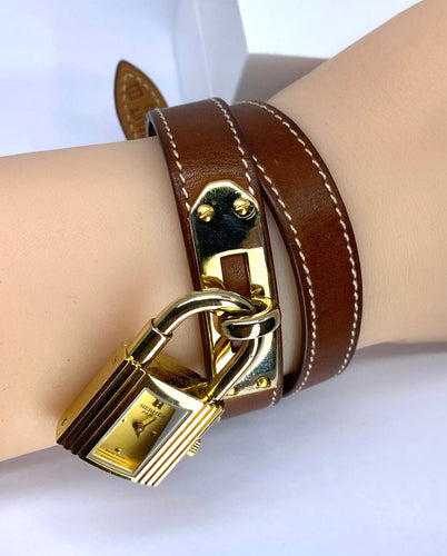 Hermès - Watch « Kelly », gold-plated PM dial, double turn brown leather