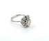 Bague 53 Bague en or blanc avec diamant central et diamants environnants 58 Facettes