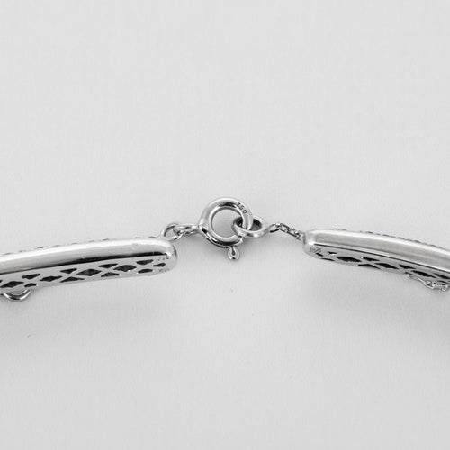 Collier Collier torque or gris et diamants 58 Facettes 250176