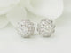 Puces d'oreilles en or blanc et diamants 58 Facettes 33522