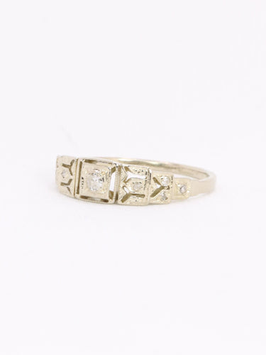 Geometrický prsten z bílého zlata s diamanty 