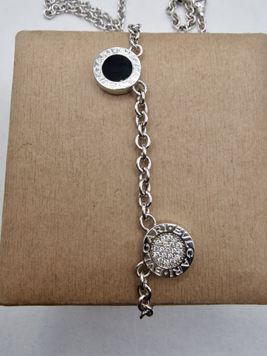 Collier Bvlgari - Collier Bvlgari Bvlgari double face pavé de diamants et onyx en or blanc 18k 58 Facettes