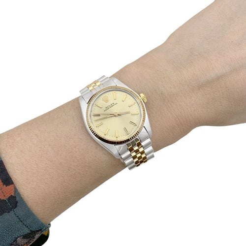 Montre Montre Rolex, "Oyster Perpetual", or jaune et acier. 58 Facettes 34921