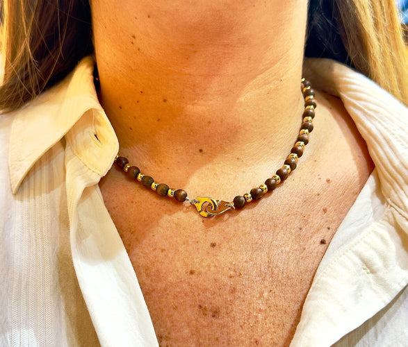 Collier Collier Dinh Van en or jaune 18 carats et boule en bois 58 Facettes