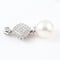 Pendentif Pendentif en or blanc 18 carats, orné de diamants naturels et d'une perle australienne. 58 Facettes