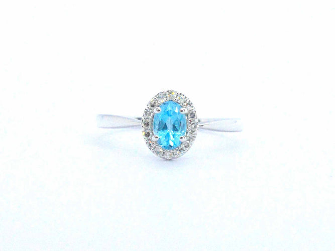 Bague Bague en or blanc avec une topaze bleue et des diamants naturels 58 Facettes 2367
