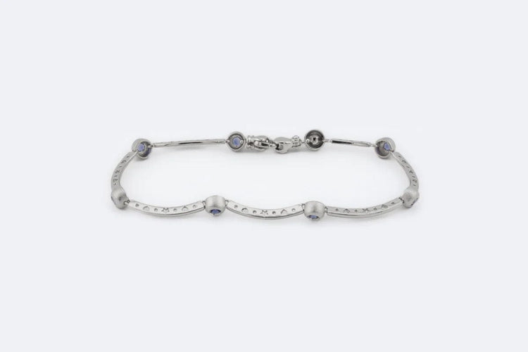 Bracelet Oro Bianco Bracelet en or blanc avec pierres semi-précieuses violettes 58 Facettes brc253