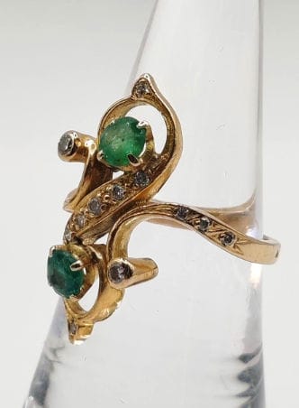 Bague 52 Bague Toi & Moi en or jaune ornée de deux émeraudes et torsadée de diamants 58 Facettes