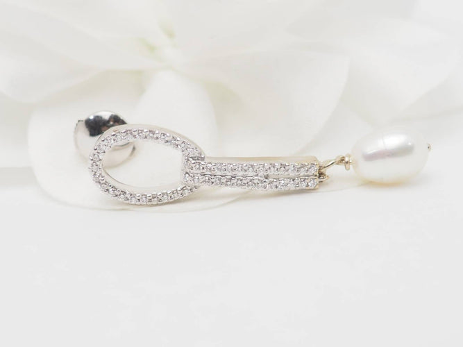 Boucles d'oreilles Pendants d'oreilles en or blanc, diamants et perles de culture 58 Facettes 33102