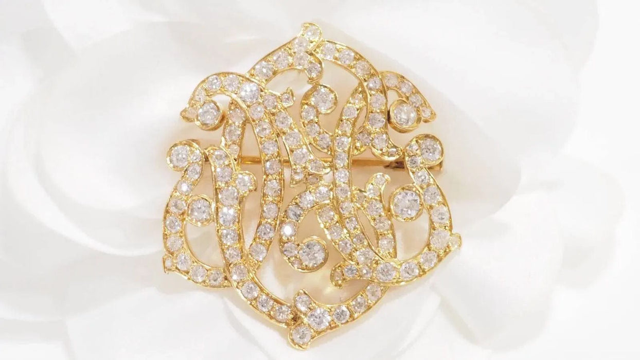 Broche Broche volutes Art Nouveau en or jaune et diamants 58 Facettes 32960