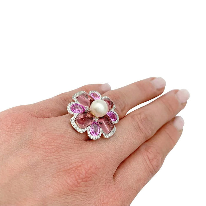 Bague 52 Bague Chanel, "San Marco", or blanc, perle, saphirs roses, tourmalines roses, diamants. 58 Facettes 34030