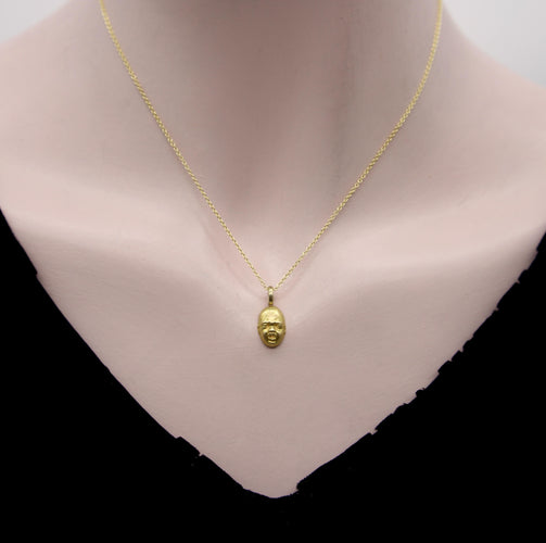 Pendentif Pendentif/breloque vintage en or 18 carats représentant un visage de bébé qui pleure 58 Facettes A2002M