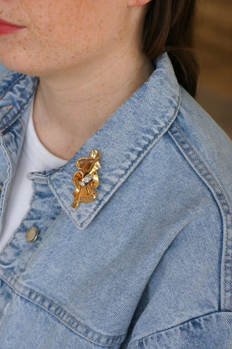 Broche Broche noeud or rose, platine et diamants 58 Facettes