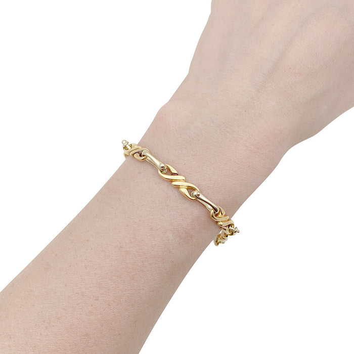 Hermès-Halskette und Armband, zwei Goldtöne.