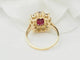Bague 54 Bague entourage en or jaune, rubis et diamants 58 Facettes F5046