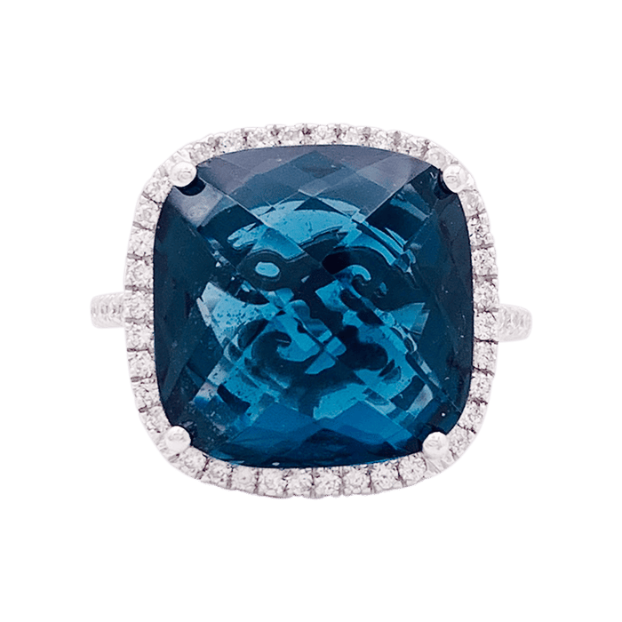 Anillo de oro, topacio azul, diamantes.