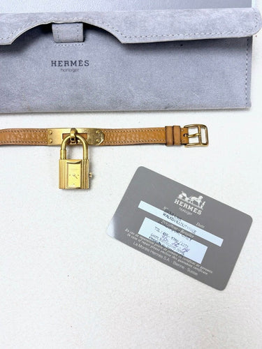 Montre Hermès - Montre Kelly en plaqué or, bracelet cuir camel 58 Facettes WC-2025-2302