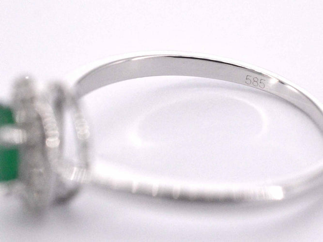 Bague 54 Bague entourage en or blanc avec diamants et émeraude 58 Facettes 2012