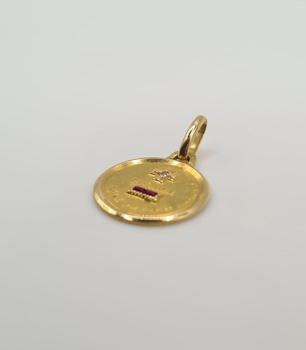 Yellow gold pendant set with a diamond and ruby