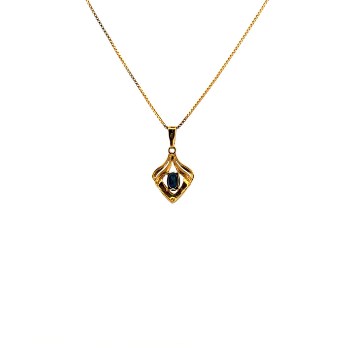 Yellow gold and topaz pendant
