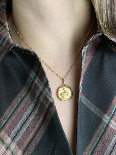 Pendentif PERROUD Pendentif vintage signe du zodiaque Sagittaire or jaune 58 Facettes 1101.3