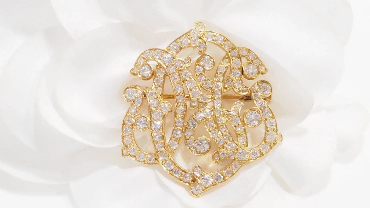 Broche Broche volutes Art Nouveau en or jaune et diamants 58 Facettes 32960