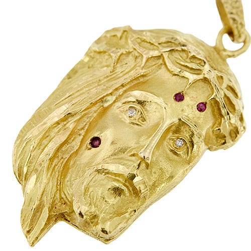 Pendentif Pendentif en or jaune représentant le visage du Christ, orné de rubis et de diamants 58 Facettes 40105