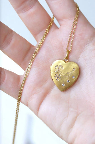 Pendentif Médaillon cœur ouvrant en or, diamants, et perles 58 Facettes