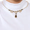Collier Collier draperie or jaune, grenats 58 Facettes PER1505