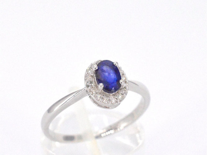 Bague 54 Bague entourage en or blanc avec diamants et saphir 58 Facettes 2010