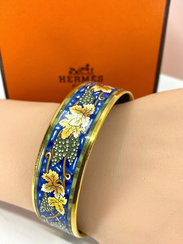 Bracelet HERMÈS - bracelet en métal doré et émail 58 Facettes AB657