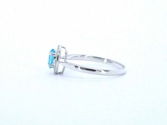 Bague Bague en or blanc avec une topaze bleue et des diamants naturels 58 Facettes 2367