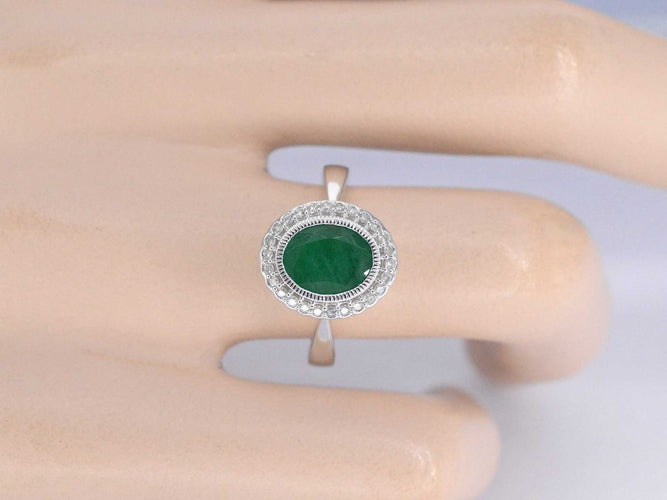 Bague 54 Bague entourage en or blanc avec diamants et émeraude 58 Facettes 2061