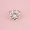 Bague 53 BUCHERER Bague florale en or blanc et diamants 58 Facettes