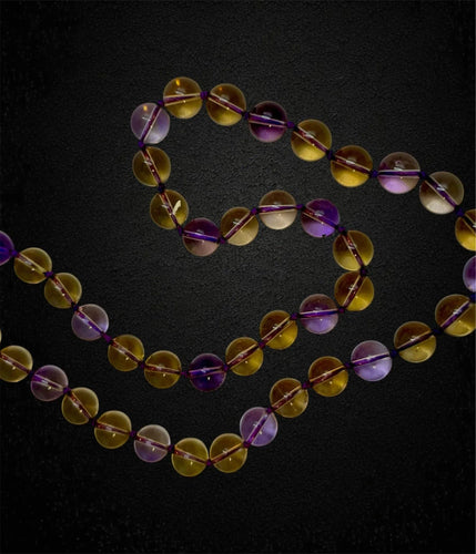 Collier Collier en quartz améthyste et citrine 58 Facettes