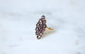 Bague 55 Bague Marquise Ancienne en Or Rose et Grenats sur Paillon 58 Facettes