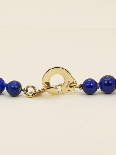 Collier DINH VAN Collier menottes R15 or jaune lapis lazuli 58 Facettes 1204.6