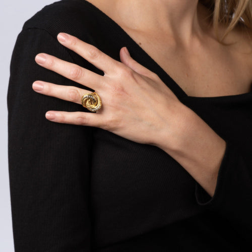 Bague 50 Bague vintage en or jaune et diamants avec nœud infini des années 70 58 Facettes G13169