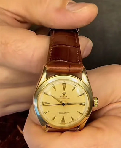 Montre Rolex Oyster Perpetual, Réf 6084, boîtier en or 14 carats 58 Facettes