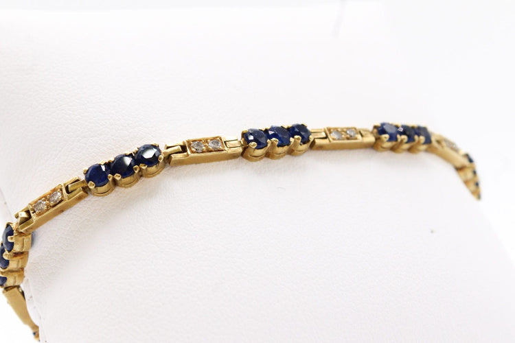 Bracelet Bracelet rivière de diamants et de saphirs, or jaune 58 Facettes 240045