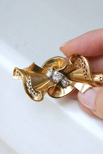 Broche Broche noeud or rose, platine et diamants 58 Facettes