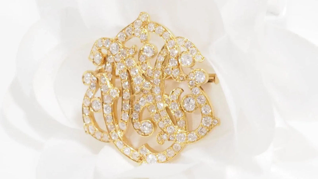 Broche Broche volutes Art Nouveau en or jaune et diamants 58 Facettes 32960