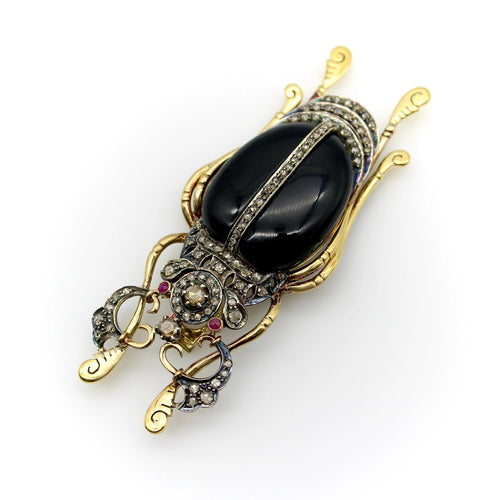 Broche Broche scarabée en or et argent avec diamants, onyx et rubis 58 Facettes