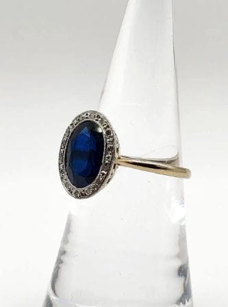 Bague 50.5 Bague Pompadour deux ors ornée d'une pierre bleue et de diamants 58 Facettes