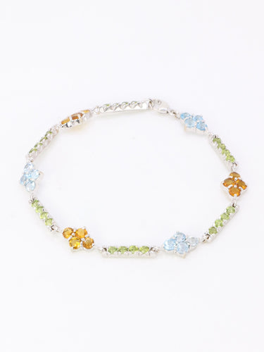 Bracelet Bracelet ligne or blanc citrines péridots topazes bleues 58 Facettes 1CA0000006/1