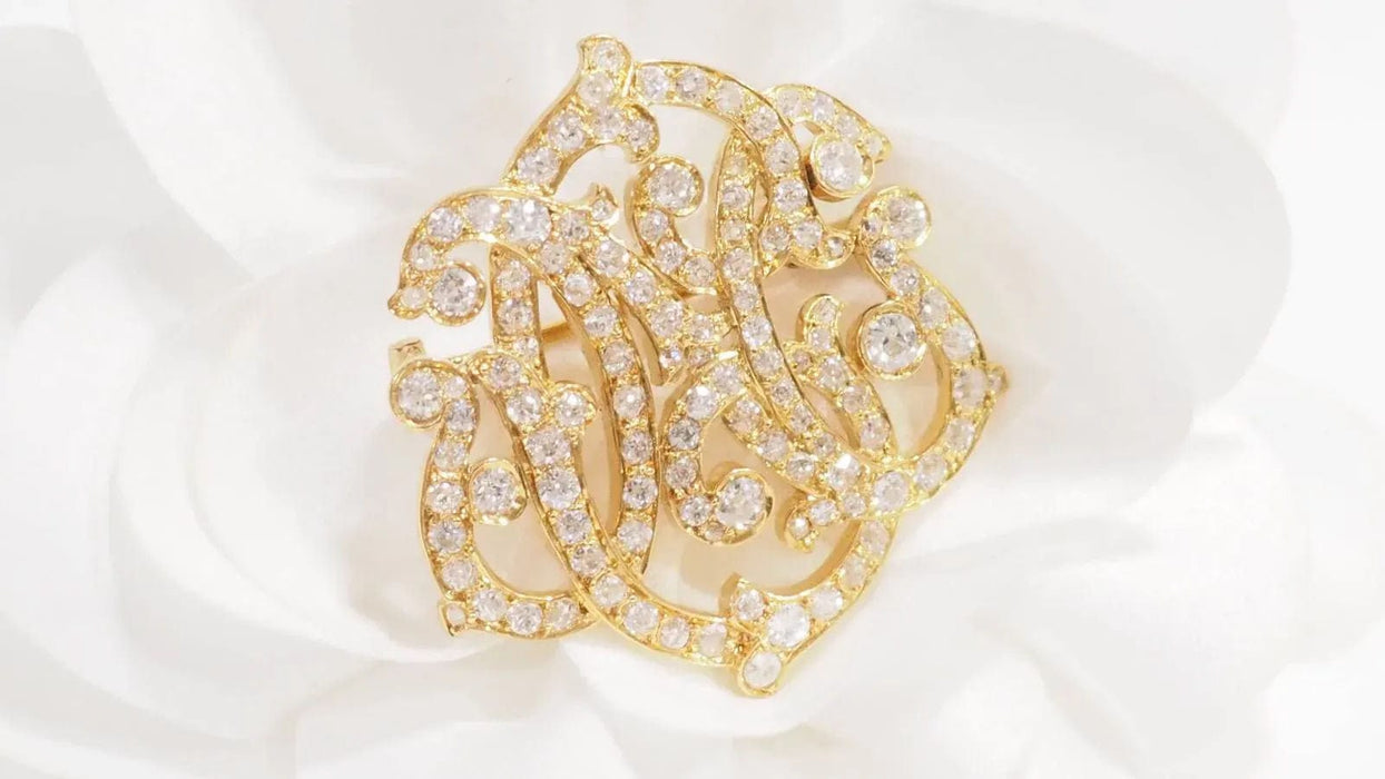 Broche Broche volutes Art Nouveau en or jaune et diamants 58 Facettes 32960