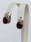 Boucles d'oreilles Boucles d'oreilles puces exquises en or blanc, serties d'un rubis rouge de 4,32 carats et de diamants 58 Facettes