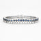 Bracelet Bracelet tennis double, or blanc, diamants et saphirs 58 Facettes 240453
