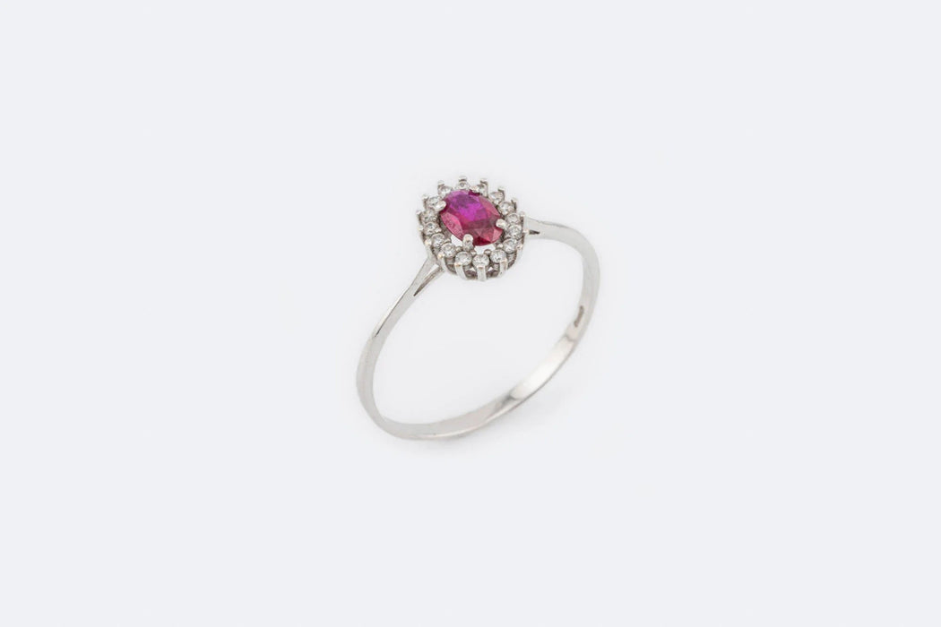 Bague 63 Bague marguerite en or blanc avec diamants et rubis 58 Facettes anl823