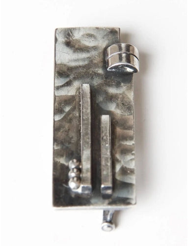 Broche Broche rare en argent martelé de Jean Despres, 1932 58 Facettes